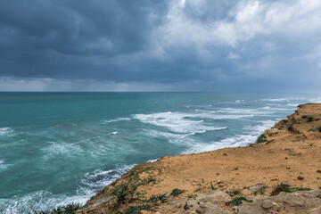 Fototapeta na wymiar Arsuf cliff, kurkar sandstone cliff reserve towering high above the Mediterranean sea coastline between Herzliya and Netanya towns, Israel.