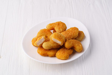Chicken nuggets on a white plate