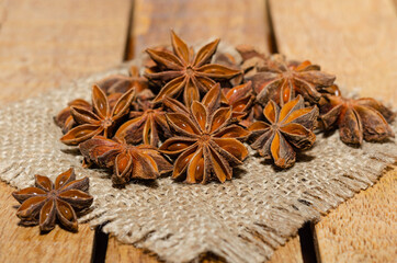 Close-up of anise star on rustic background 