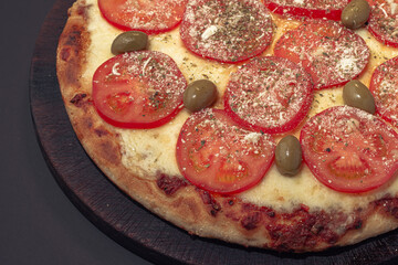 Home made Napolitana italian Pizza with cheese and tomate sauce. 