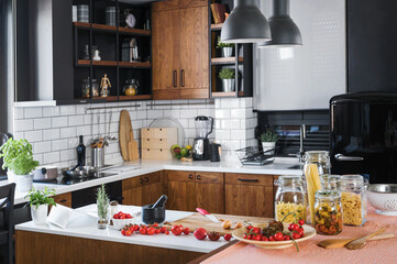 Modern home kitchen interior with fresh ingredients ready for cooking