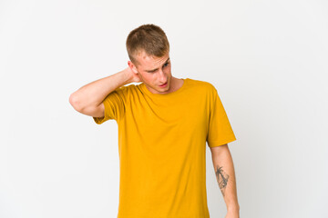 Fototapeta premium Young caucasian handsome man having a neck pain due to stress, massaging and touching it with hand.