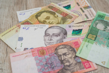 Many different hryvnias. Money background.