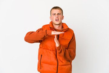 Young caucasian handsome man showing a timeout gesture.