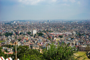 Fototapeta premium Nepal, Kathmandu,Cityscape seen from the Monkey Temple. Pollution over the citycenter