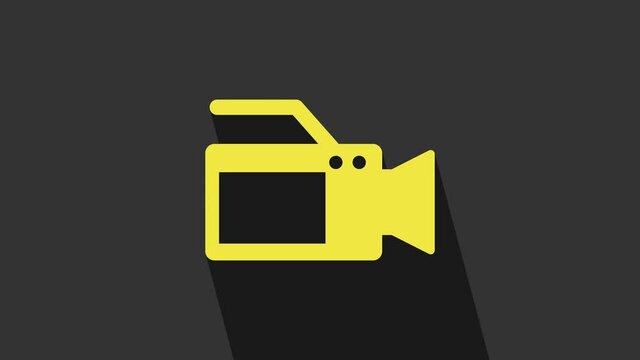 Yellow Cinema camera icon isolated on grey background. Video camera. Movie sign. Film projector. 4K Video motion graphic animation