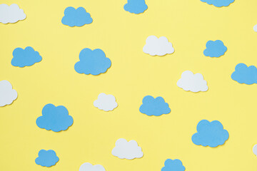 Elements in shape of clouds surrounding yellow background with space for text on orange background. Mockup, copy space