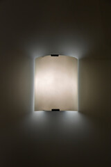 Minimalistic design of the lamp as an element of the decor of a modern room