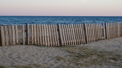 Fototapeta premium rustic wooden fence by the sea