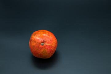Fototapeta na wymiar fresh pomegranate fruit on a dark background