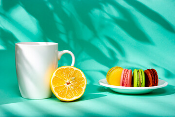 A cup of tea and lemon in the sunlight. Morning tea. Sunny day, the shadow of the leaves.