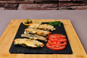 vegetarian dish cheese sticks on a black plate healthy food