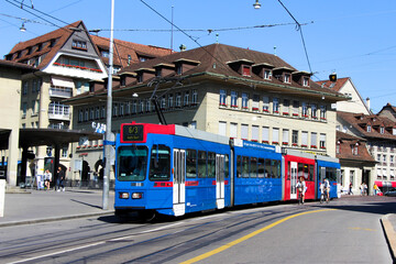 Fototapeta na wymiar Tram in Bern Switzerland, public transport train red and blue
