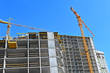 Crane and highrise construction site