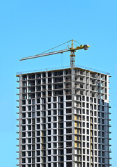 Fototapeta premium Crane and highrise construction site