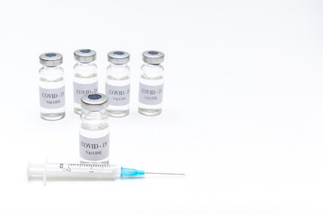 bottles with coronavirus vaccine, healthcare syringe, developed for protection against COVID-19. Prevention, disease with vaccination injection treatment