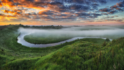 Beautiful spring sunrise over river banks