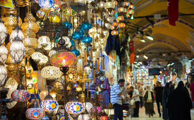 Tourists shopping in the Grand Bazaar. Interior view of the Grand Bazaar of Istanbul