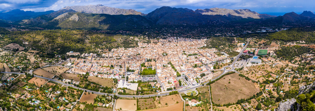 Spain, Balearic Islands, Majorca, Pollena, Town and&not;&dagger;Tramuntana Mountains, aerial view