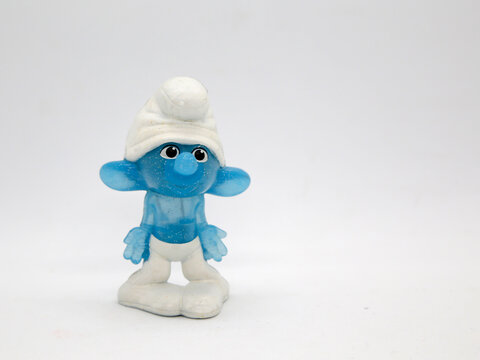 The smurfs.  Silly smurf. Little blue creatures that live in mushroom houses in the woods. Television characters, movies and comics. Blue creatures.