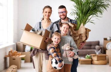 Positive family standing in room in new flat