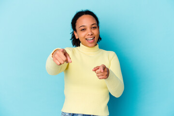 Young african american mixed race woman isolated cheerful smiles pointing to front.