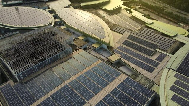 4K UHD Footage Of Aerial view of a solar panel on building roof top. Part of reduce reuse and restore concept	