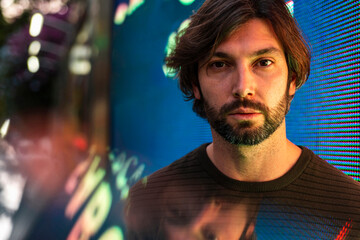 Portrait of man surrounded with digital data