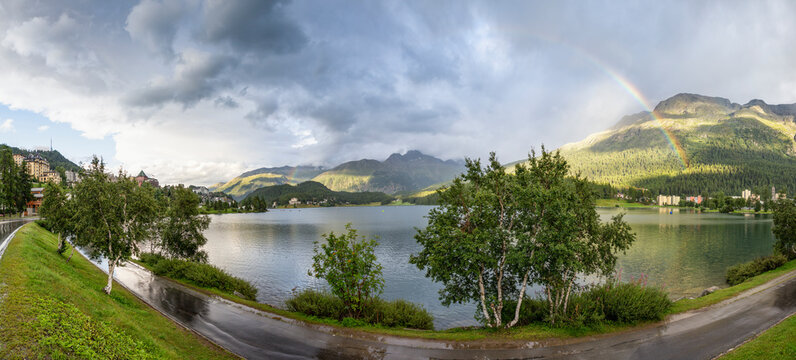 Switzerland, Canton Of Grisons, Sankt Moritz, Scenic panorama of rainbow arching over Lake Sankt Moritz