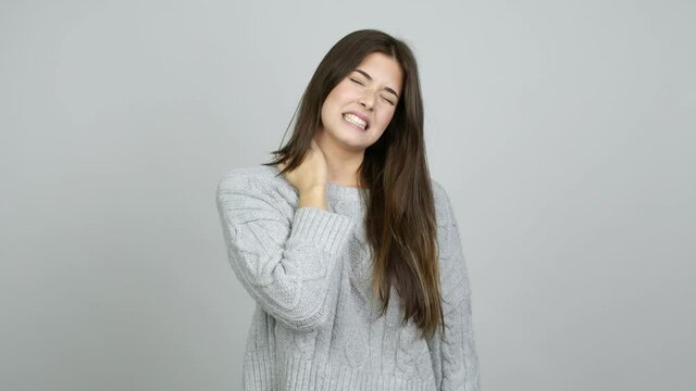 Teenager Brazilian girl with neck pain over isolated background