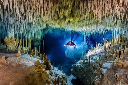 Male diver exploring in underwater, Cenote Uku Cusam, Quintana Roo, Mexico