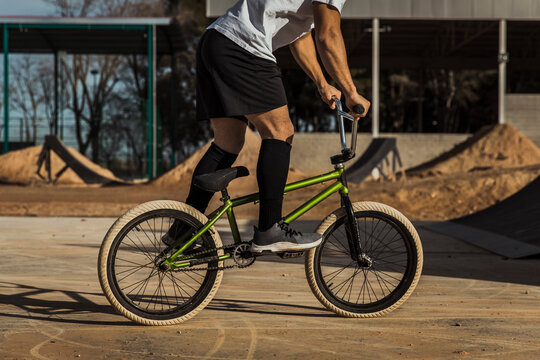 Man cycling at bike park on sunny day