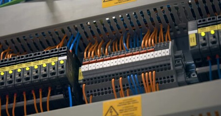 Electrical panel with many wires, electrical parts, automatic switches, breakers, residual current devices, fuses, terminals 