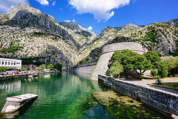 Fototapeta premium Ancient walls and the moat of Kotor town, Montenegro