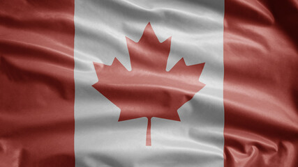 Canadian flag waving in the wind. Close up of Canada banner blowing, soft silk.