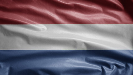 Dutch flag waving in the wind. Close up of Netherlands banner blowing, soft silk