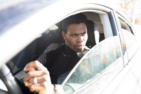 Young man driving car