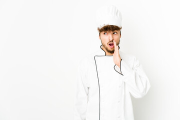 Young arab cook man is saying a secret hot braking news and looking aside