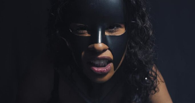 Cat woman is showing her teeth, aggressive woman, curly hair, mask, 4k