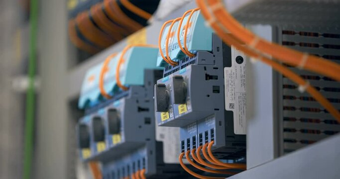 Electrical panel with many wires, electrical parts, automatic switches, breakers, residual current devices, fuses, terminals 