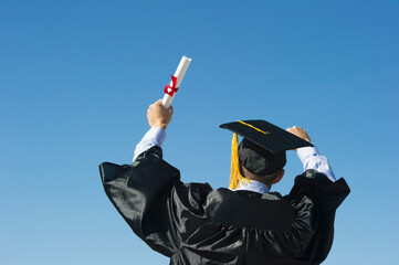 Teenage boy (16-17) at his graduation ceremony