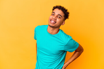 Young african american curly man isolated on purple happy, smiling and cheerful.