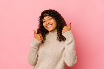 Young african american afro woman isolated raising both thumbs up, smiling and confident.