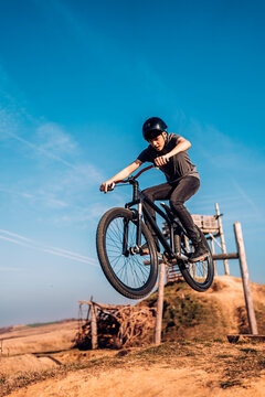 Mountain Biker Flying Through The Air After Jumping Off A Ramp