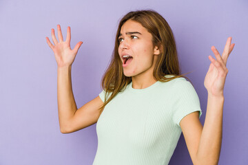 Fototapeta premium Young skinny caucasian girl teenager on purple background screaming to the sky, looking up, frustrated.
