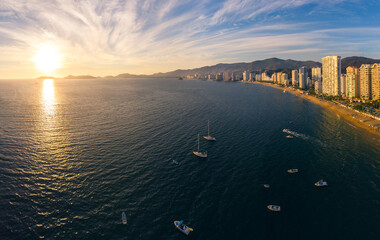 Beautiful sunset, aerial view of the beach, acapulco city seen from above. Travel and vacation...