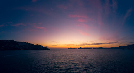 Beautiful sunset, aerial view of the beach, acapulco city seen from above. Travel and vacation...