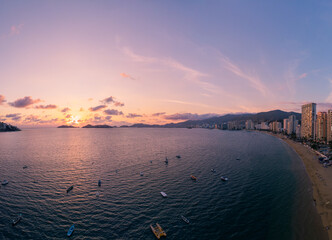 Beautiful sunset, aerial view of the beach, acapulco city seen from above. Travel and vacation...