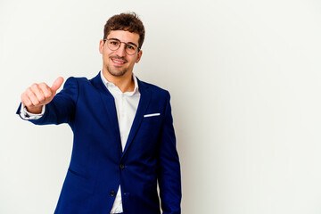 Young business caucasian man isolated on white background smiling and raising thumb up