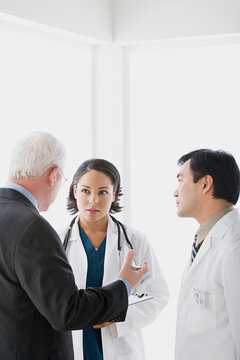 Three doctors in discussion